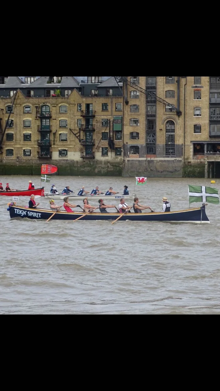 Cornish Pilot Gig crew rowing together on the River Teign