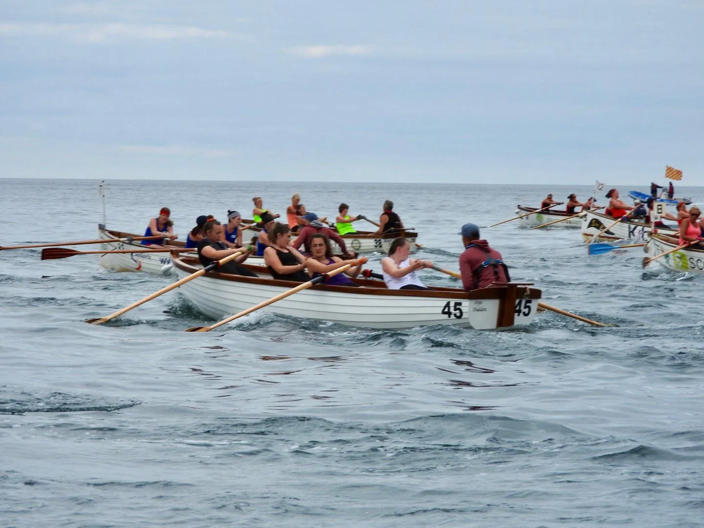 Traditional Seine Boat crews racing side by side at sea